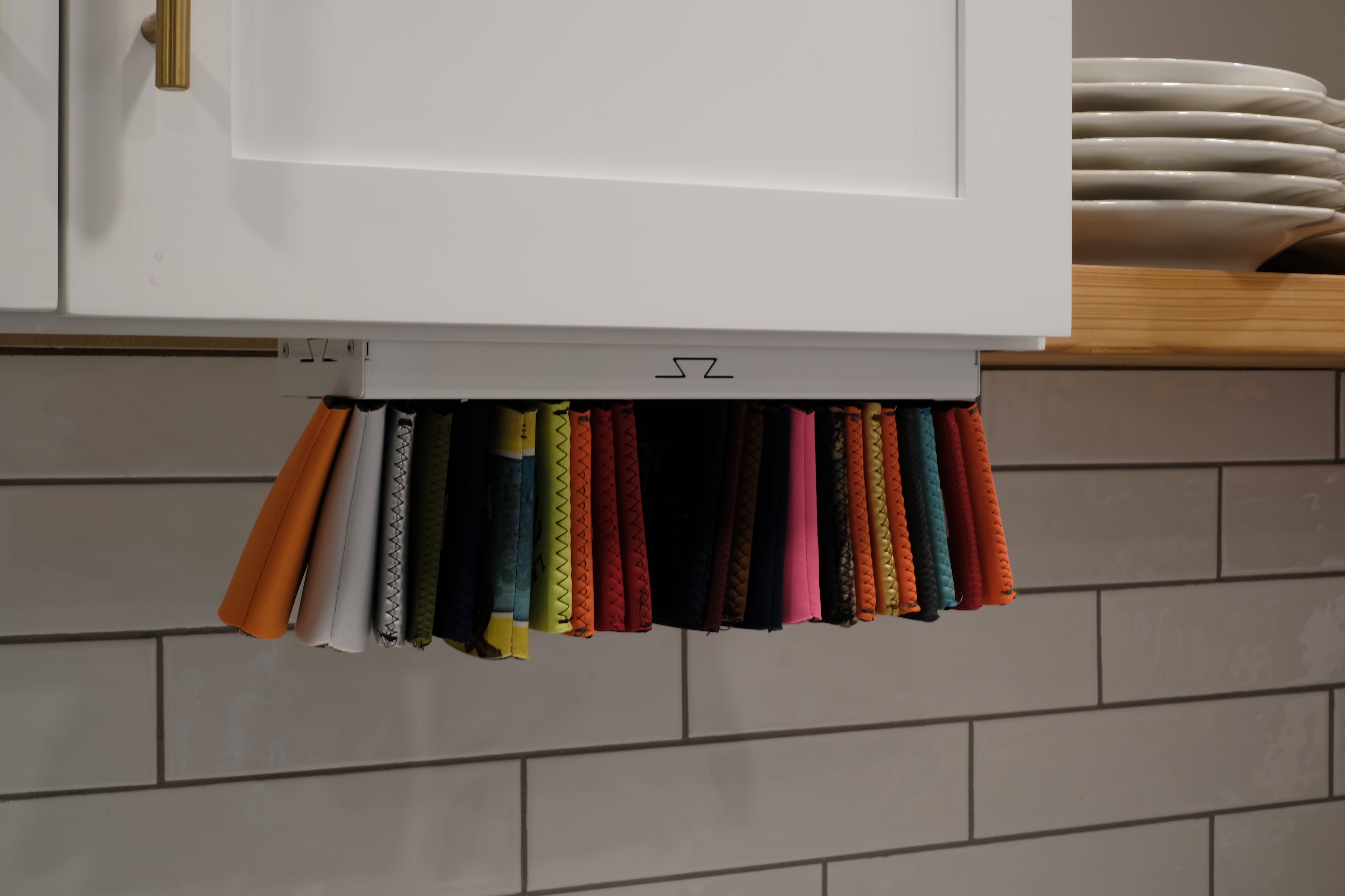 Under cabinet koozie holder mounting